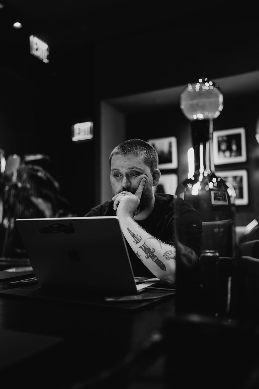 Cooper reviewing footage on a laptop