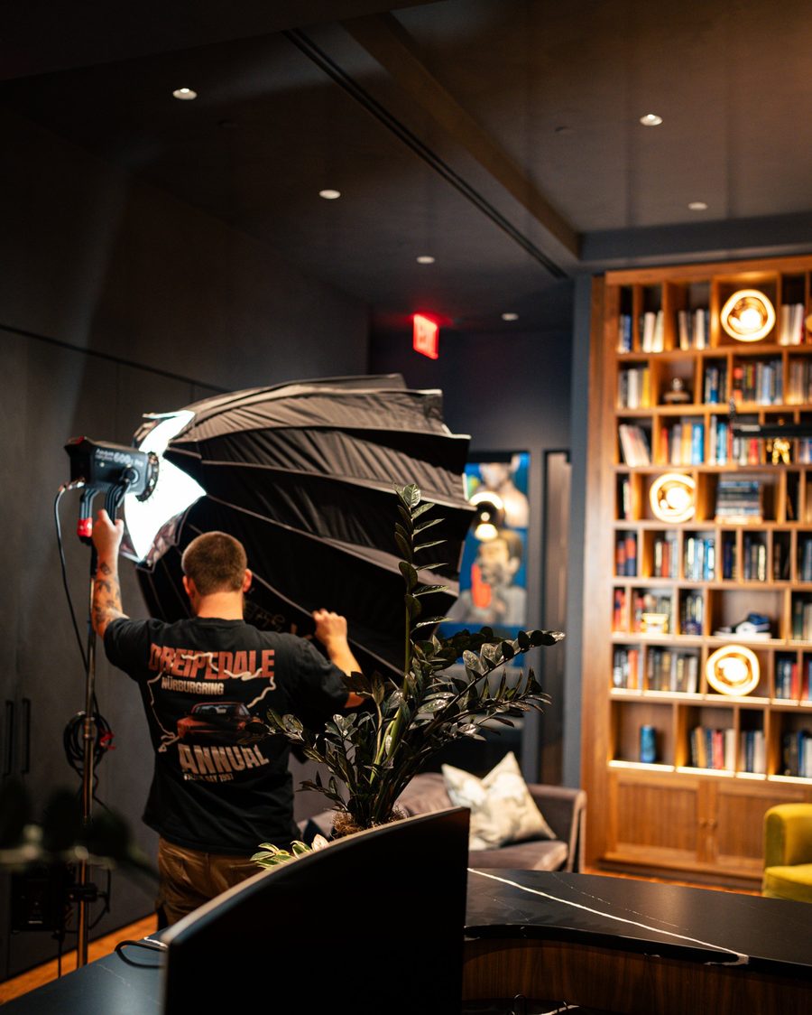 Cooper setting up a softbox light on an interior shoot